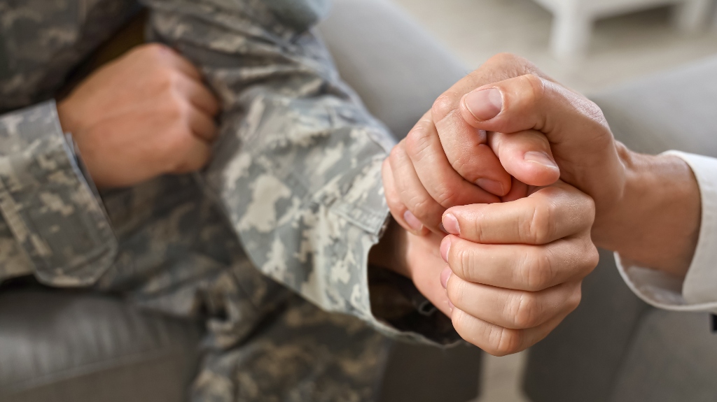 lawyer is calming soldier during cinversation