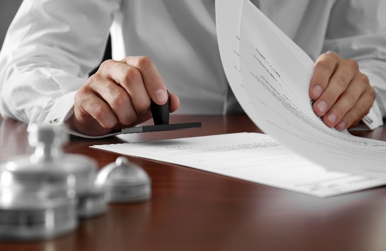 lawyer is putting stamp on the document