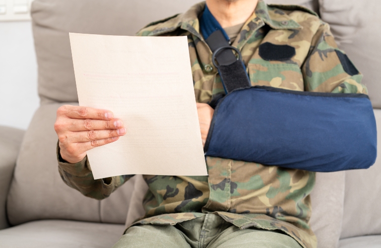 Reading letter about Injury and soldier compensation paperwork