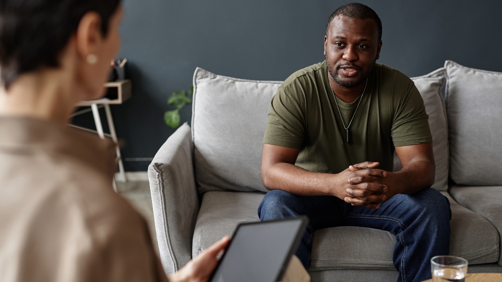 f African American adult man as army veteran sharing struggles with mental health